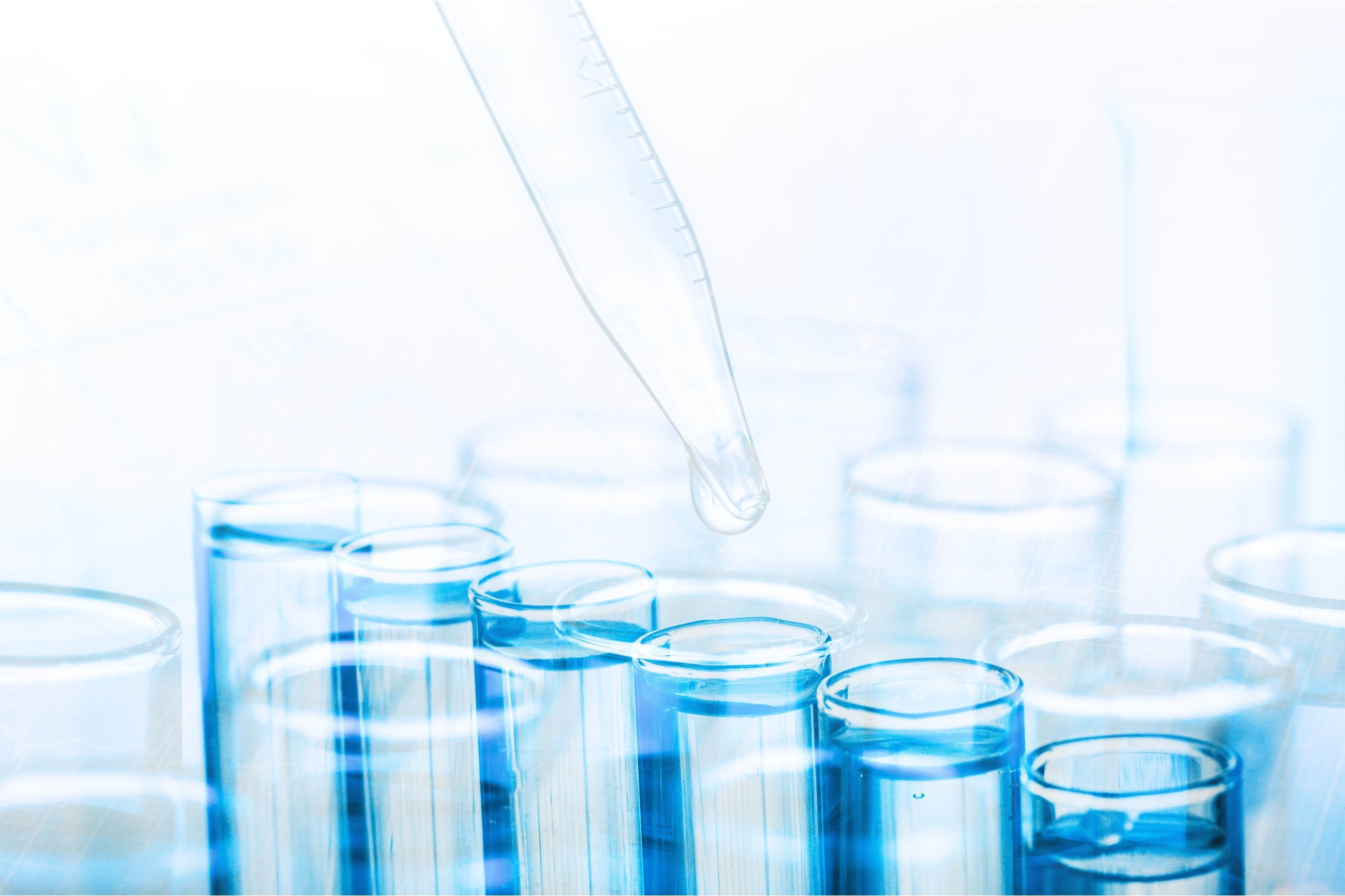 Liquid being dropped into test tube