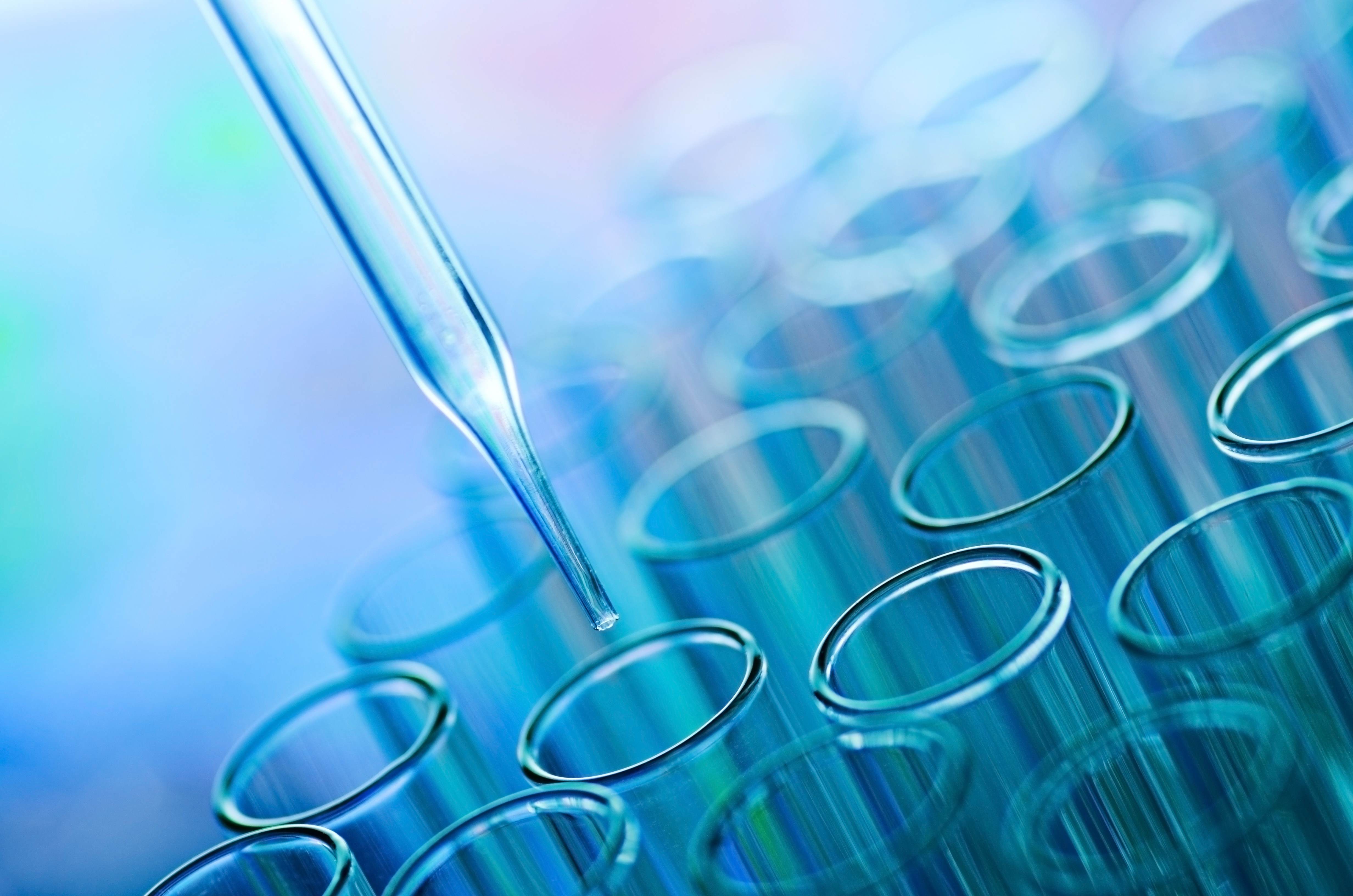 Liquid being dropped into test tubes