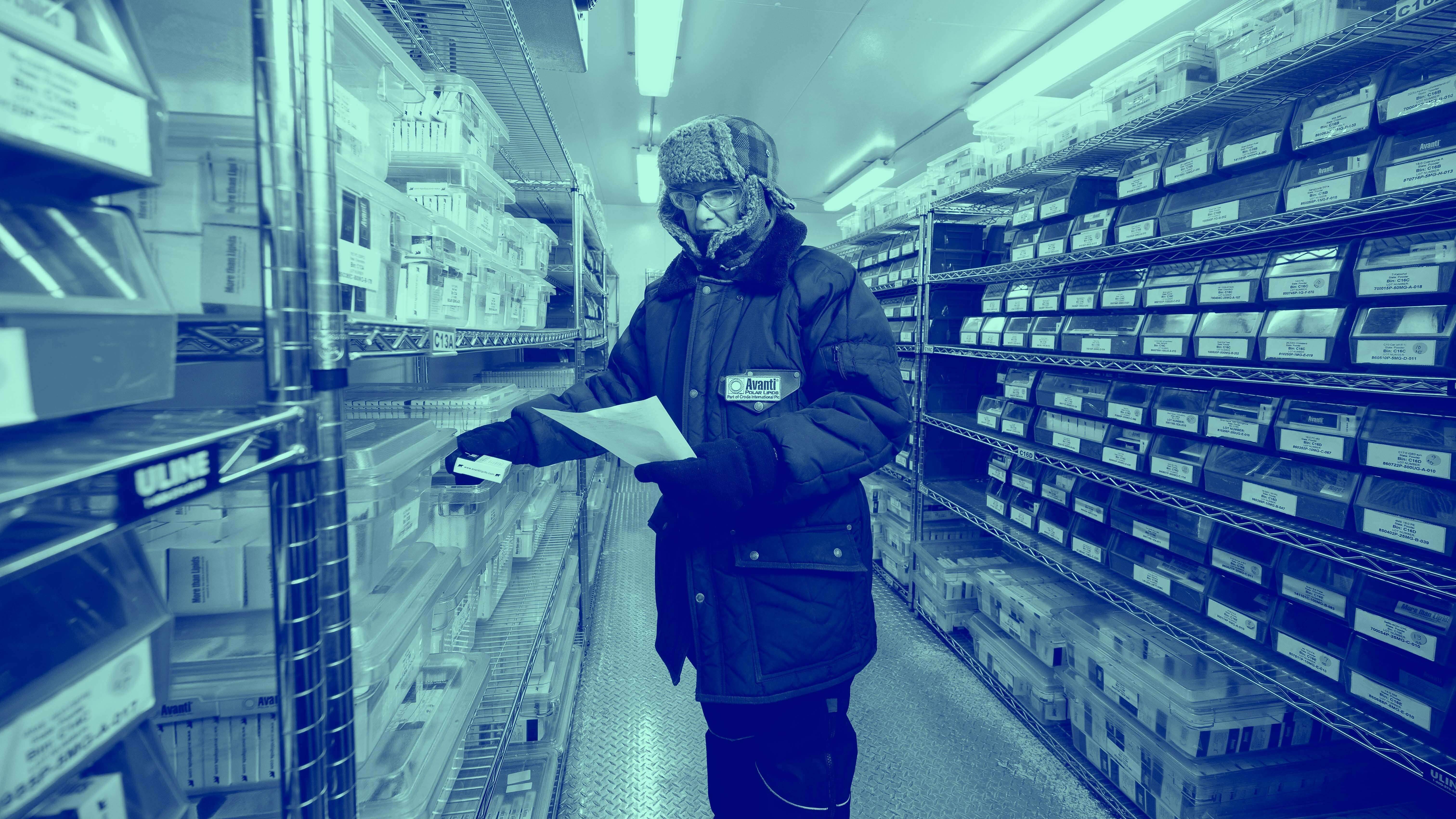 Blue washed image of Avanti Research worker in the shipping area