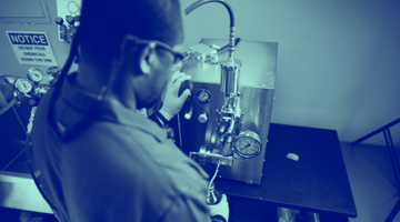 Blue washed image of male in lab