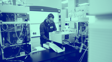 blue washed image of male in lab