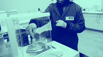 Blue washed image of male in lab