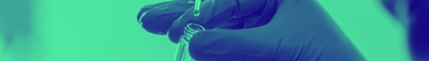 Green washed image of hand holding test tue