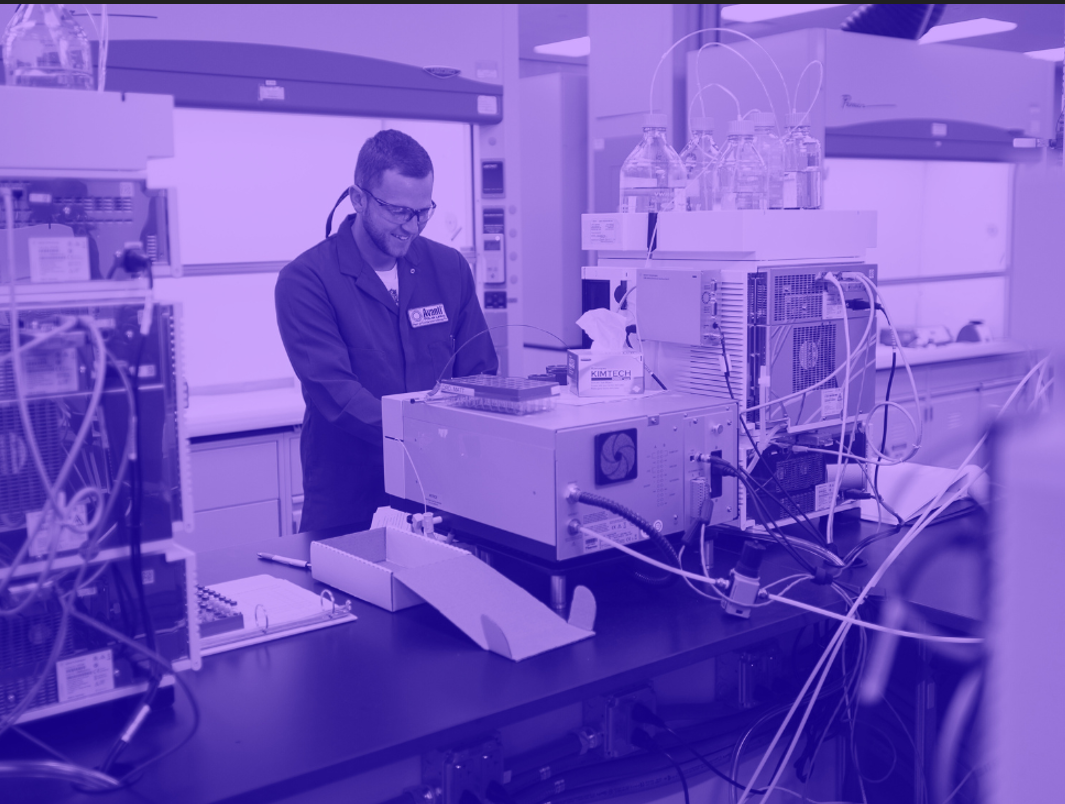 Purple washed image of male in lab