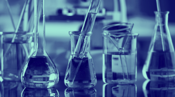 Blue washed image of beakers 