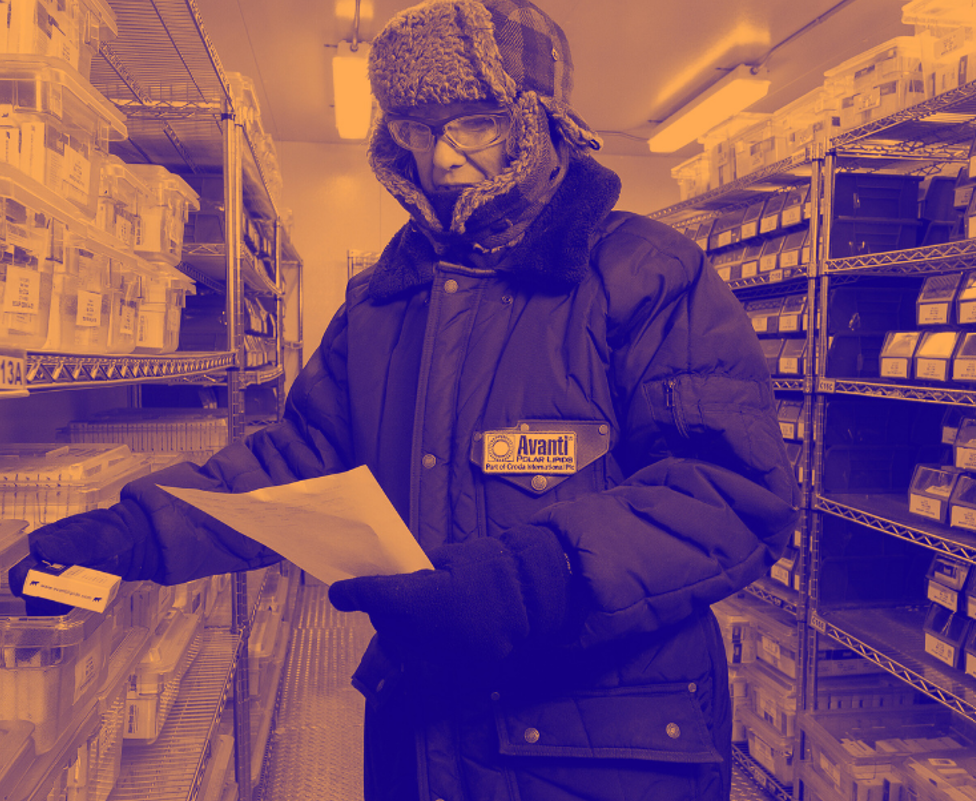 Orange washed image of male picking in warehouse