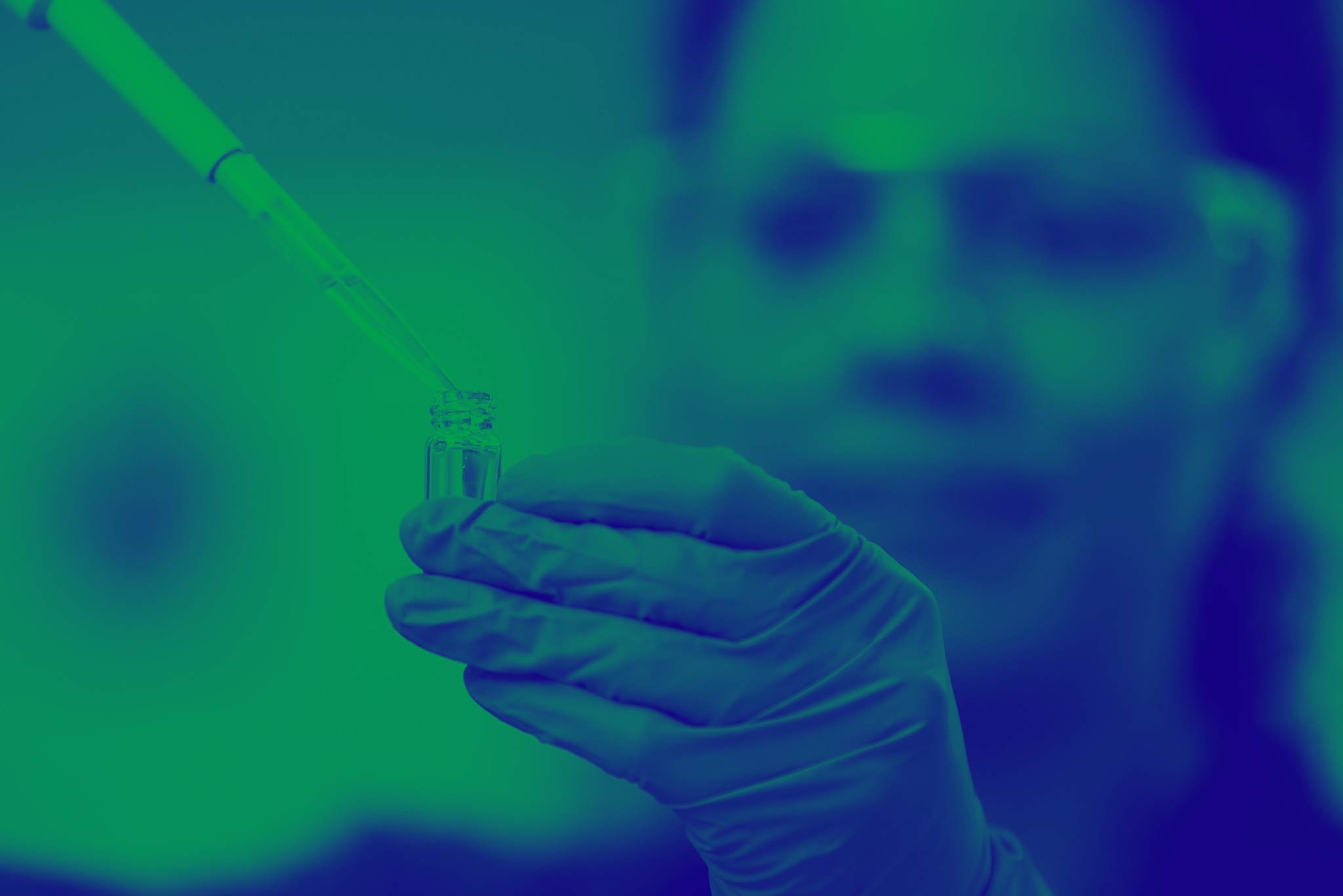 Scientist pipetting an excipient