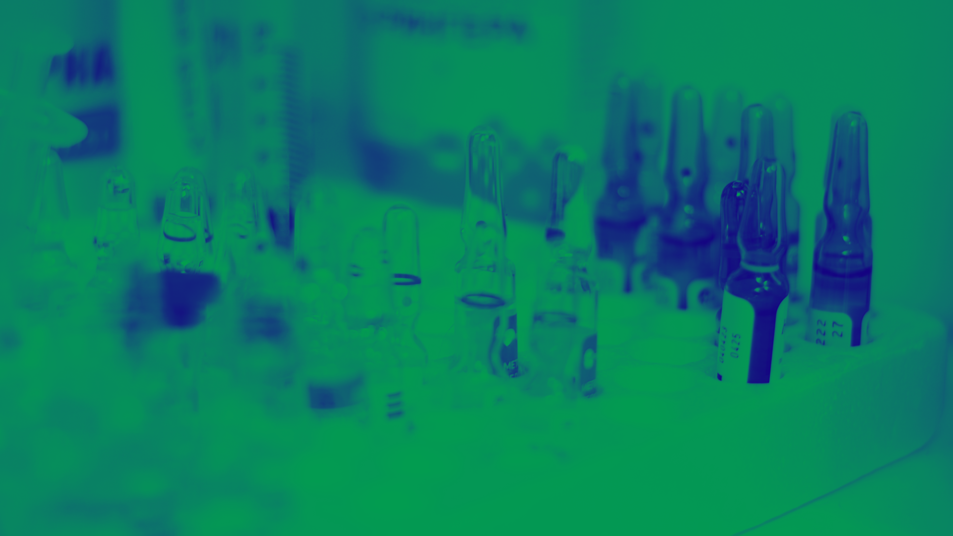Green and blue washed image of vials in lab