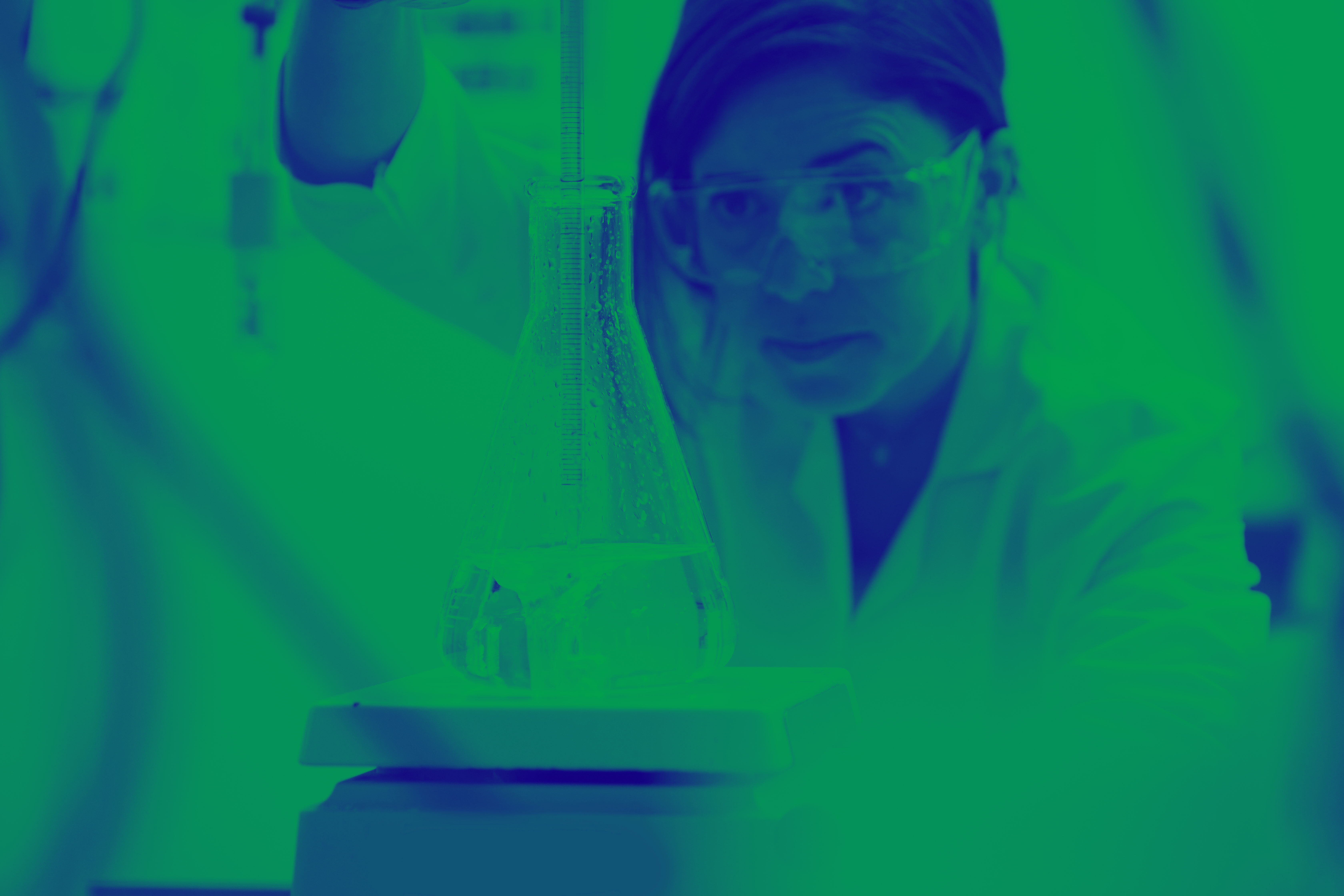 Green and blue washed image of female in lab