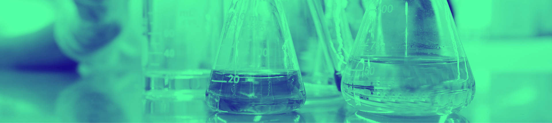 green washed image of beakers in lab